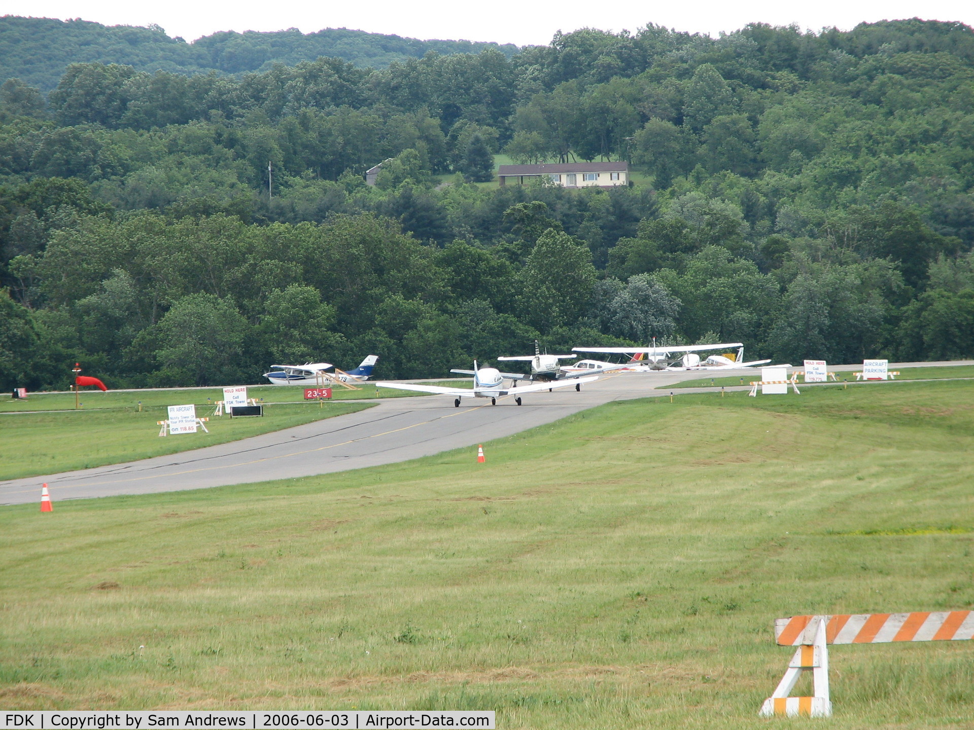 Frederick Municipal Airport (FDK) - This was the line for departure from the 2006 AOPA Fly-In.  If that was my house I would have a deck on the roof and sit and watch the antics on the runway everyday.  FDK is MD's second busiest airport that makes for some pretty good antics.