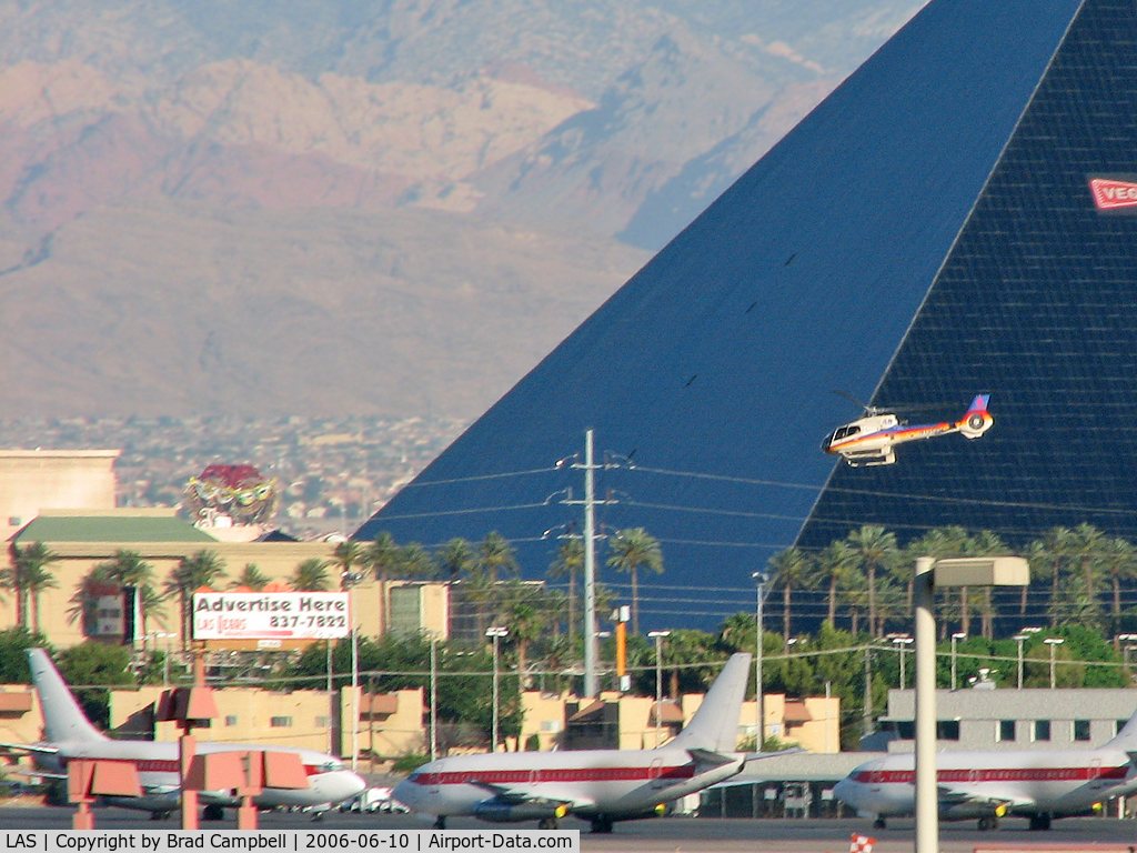 Mc Carran International Airport (LAS) - One of the many 'Tour' Helicopter flying past the Luxor and the Janet Ramp.