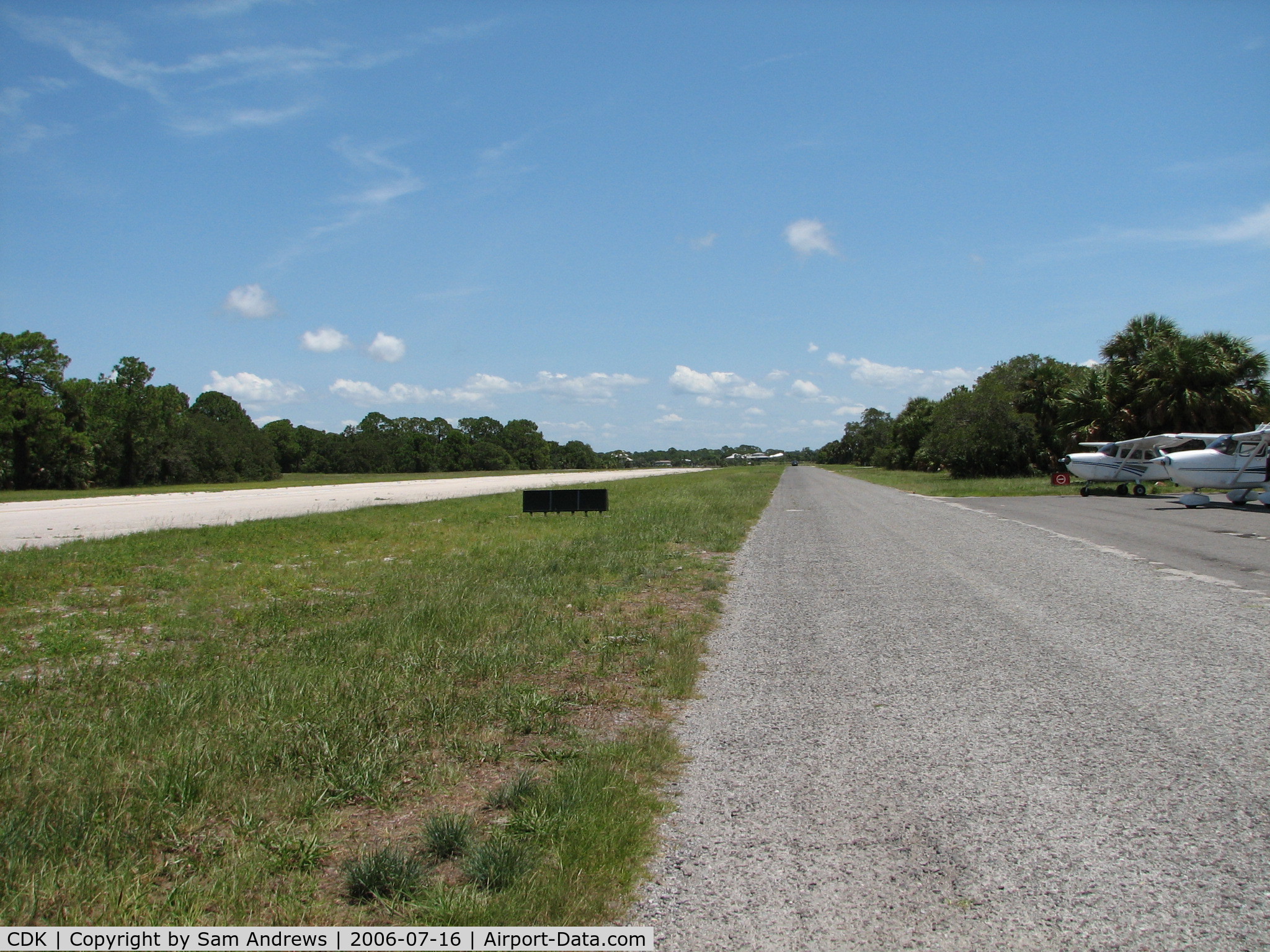 George T Lewis Airport (CDK) - Looking toward the approach end of 23.  That is not a taxiway it is a road.