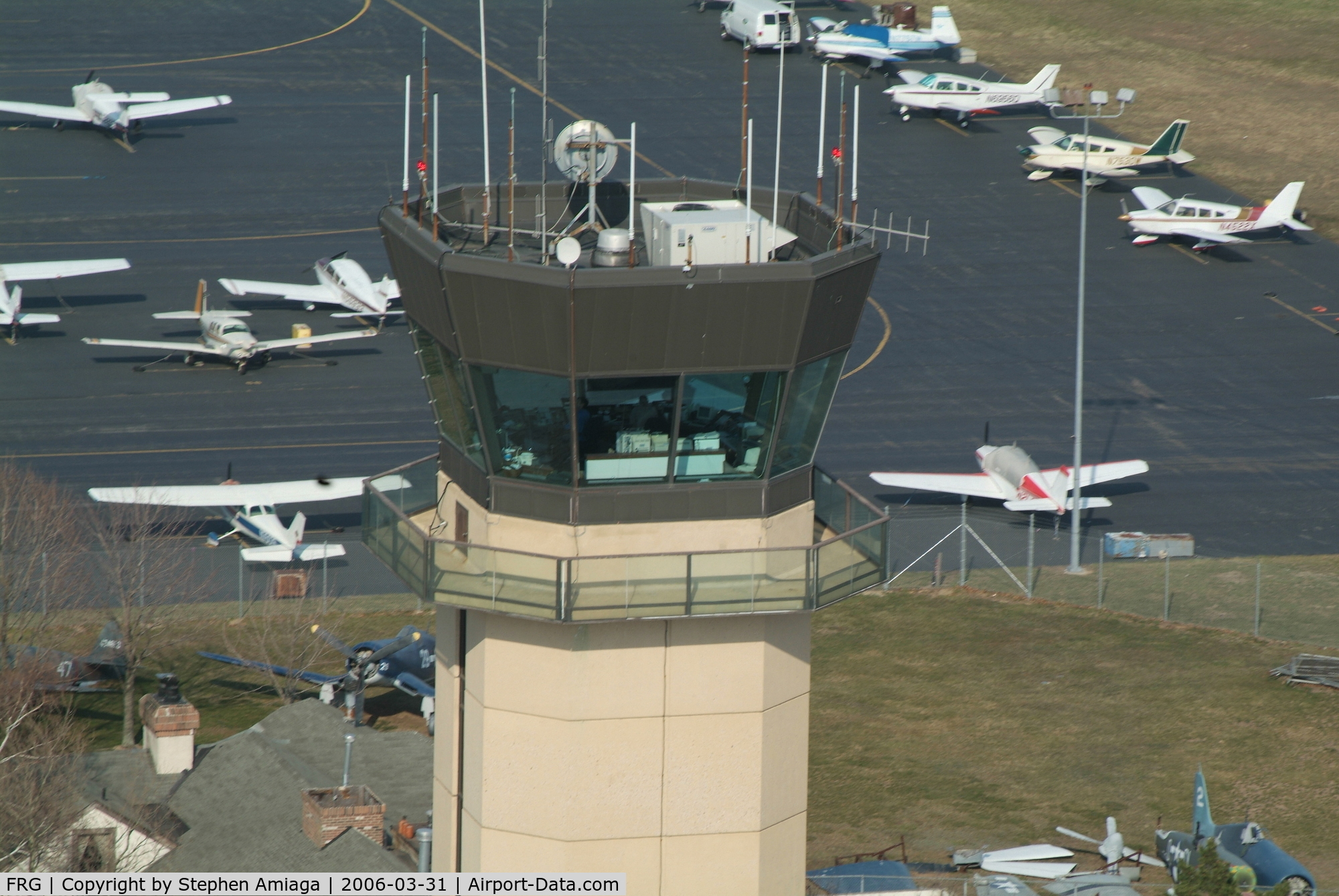 Republic Airport (FRG) - A close flyby of the tower approaching the Bravo runup area....