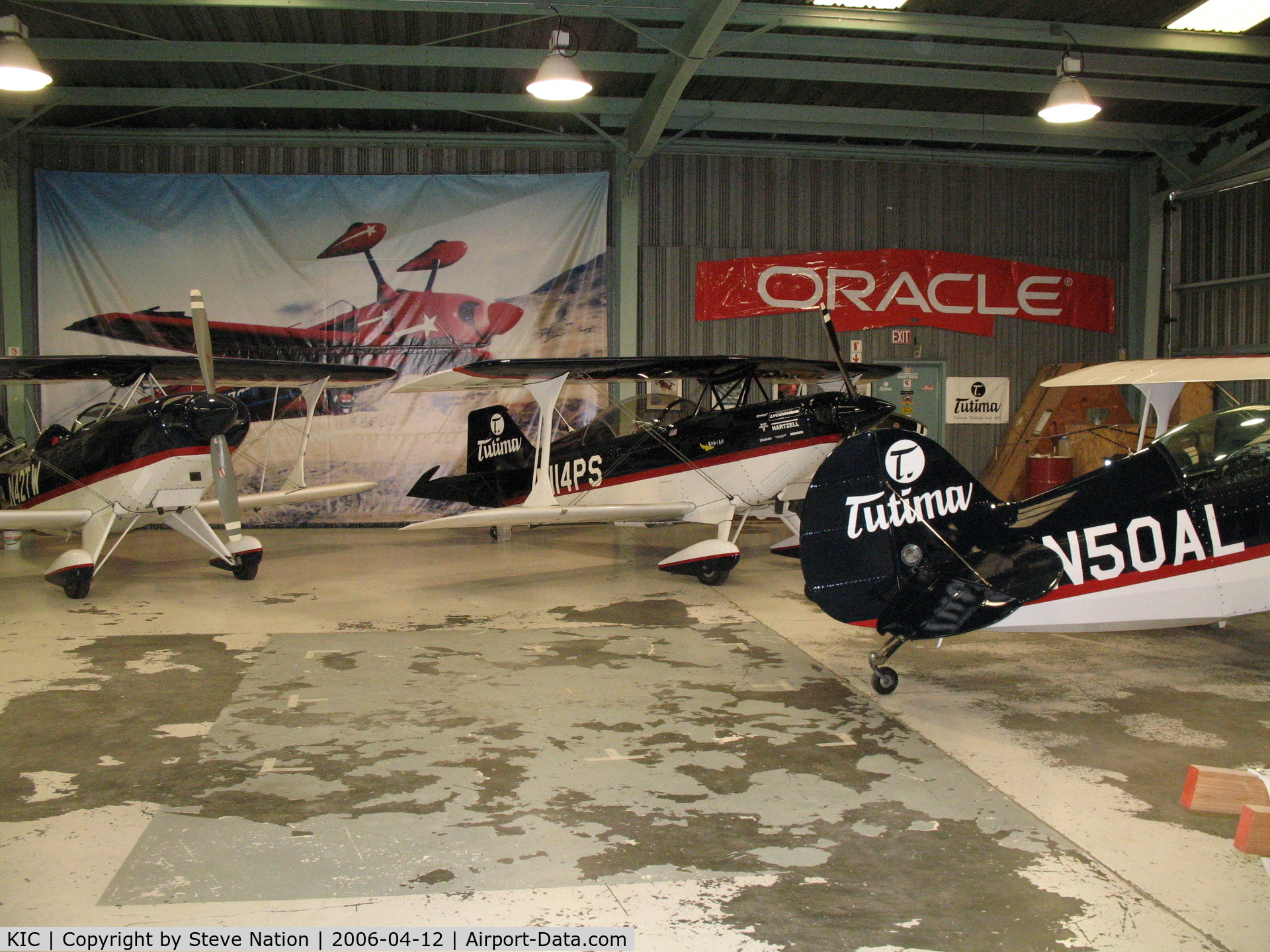 Mesa Del Rey Airport (KIC) - Sean D. Tucker School of Aerobatic Flight hangar with Pitts S-2Bs N42TW and N50AL and S-2C N114PS visible (Mesa Del Rey Airport, King City, CA)