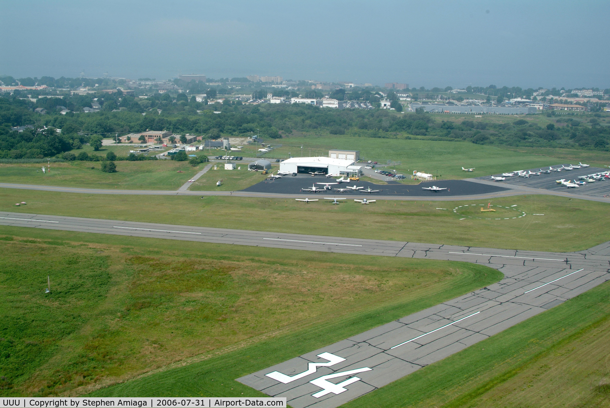 Newport State Airport (UUU) - Tight view of the ramp departing east.