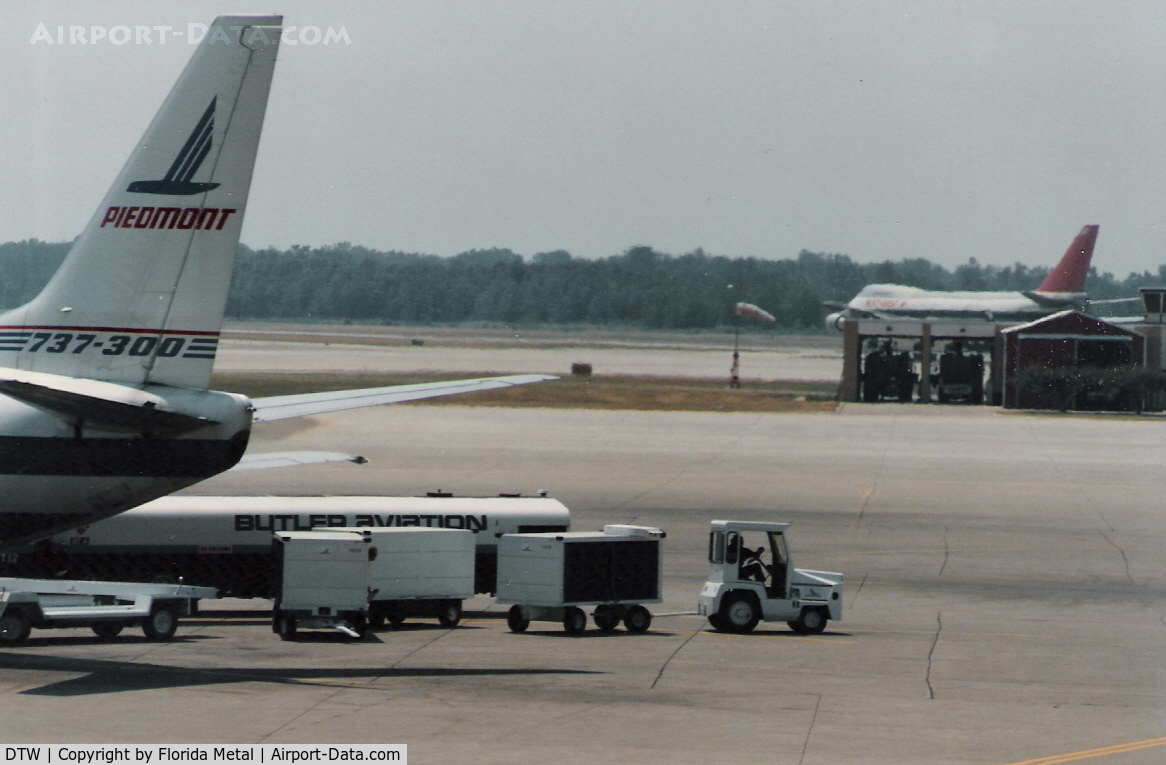 Detroit Metropolitan Wayne County Airport (DTW) - Northwest 747-200 departs in background 1988