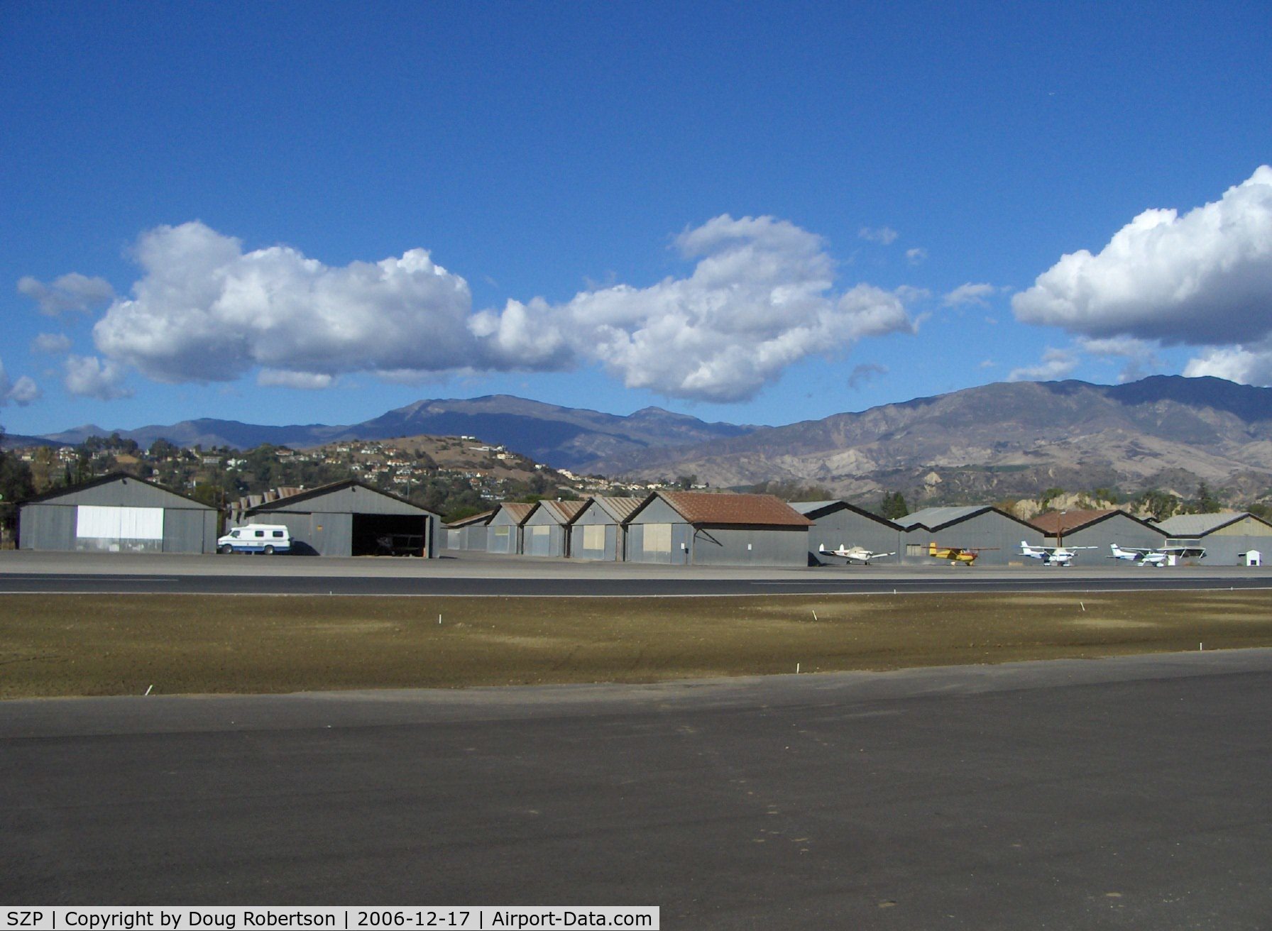 Santa Paula Airport (SZP) - Old Hangars, Topa Topa Mountains, Santa Paula Ridge, Santa Paula Peak in background. Elevations:  Topa Topa Mts. 6,244 ft & 6,704 ft. Ridge 2,817 ft. Peak 4,917 ft.