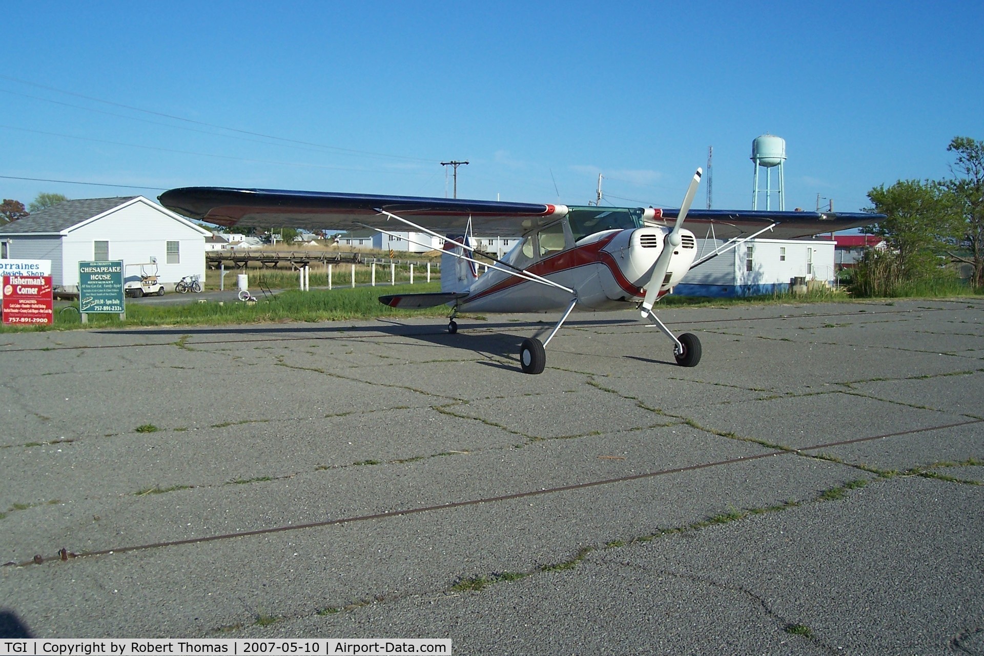 Tangier Island Airport (TGI) - C140 at the edge of parking lot.