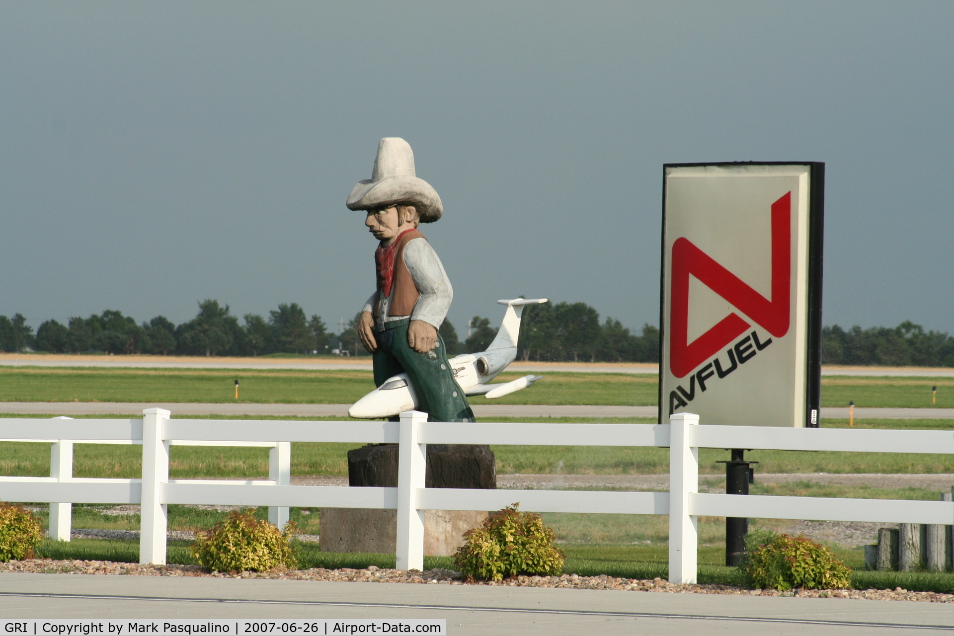 Central Nebraska Regional Airport (GRI) - Cowboy on top of a Lear Jet at the General Aviation Terminal.