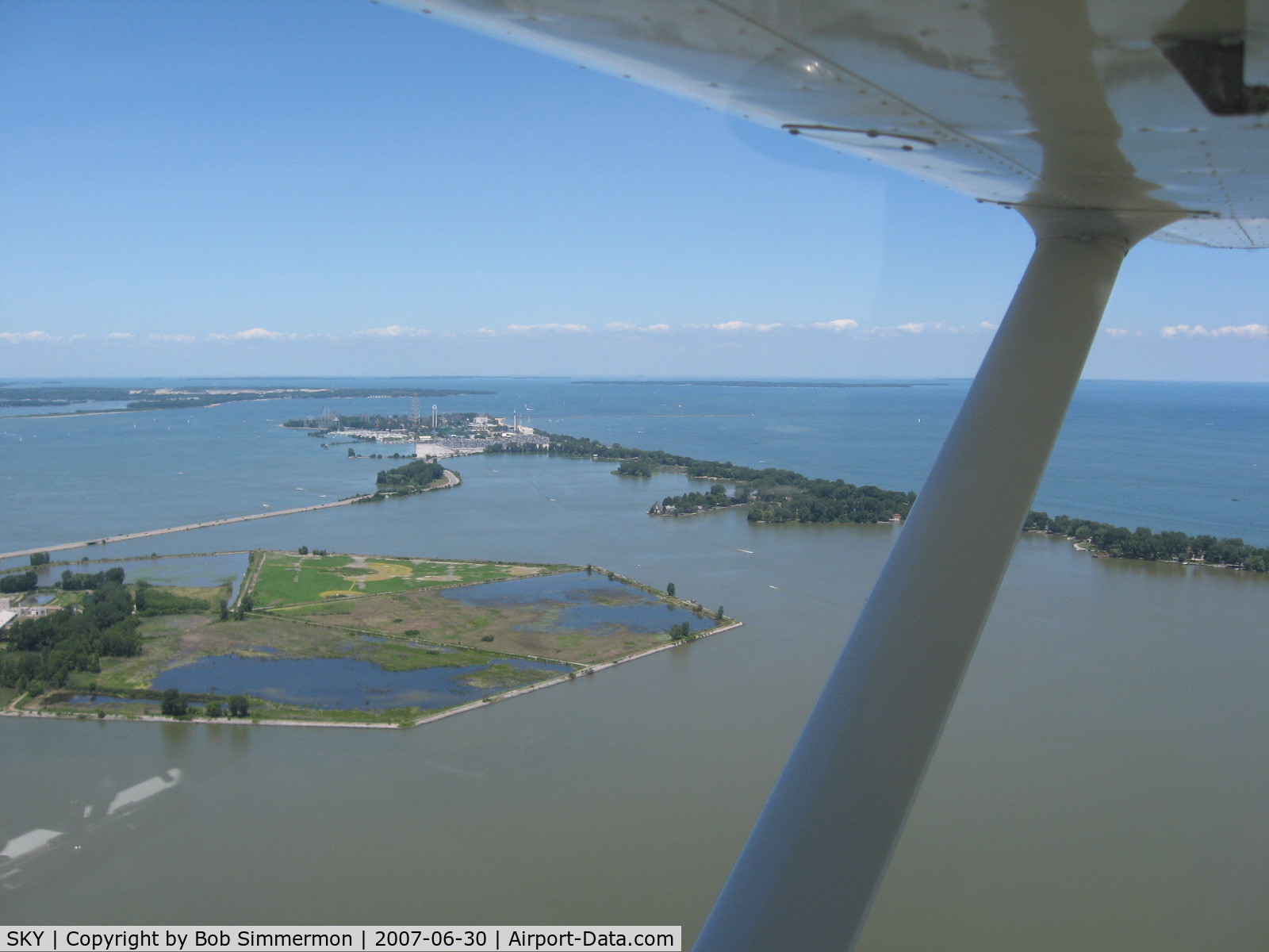 Griffing Sandusky Airport (SKY) - In the pattern on downwind for runway 9, looking north at Cedar Point amusement park.