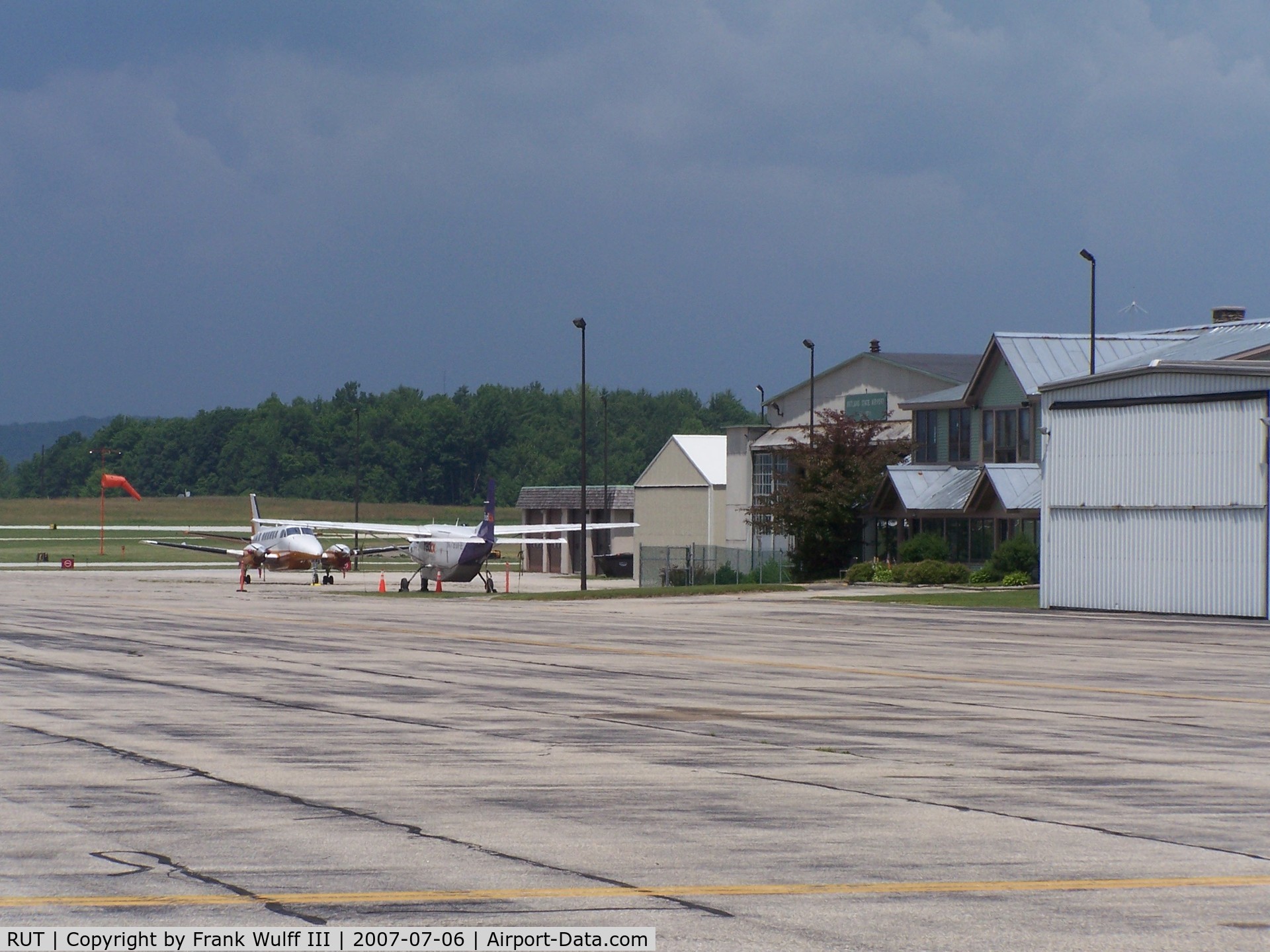 Rutland - Southern Vermont Regional Airport (RUT) - Taken on the tie down area. This is the Backside of the terminal. In the distance you can see the Civil Air Patrol hangars.