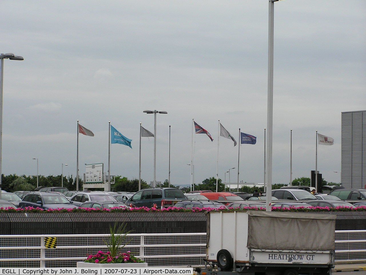 London Heathrow Airport, London, England United Kingdom (EGLL) - Airline Flags outside Terminal 4 at Heathrow