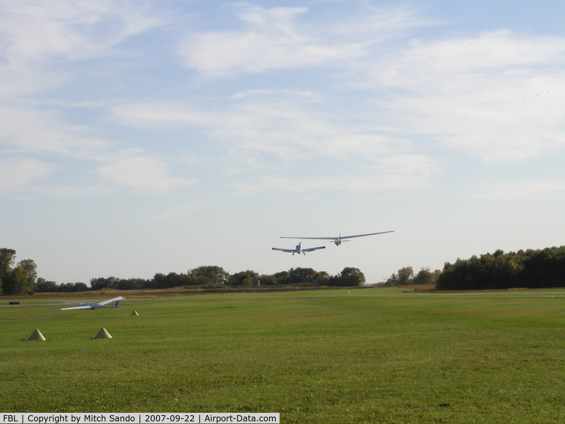 Faribault Municipal Airport (FBL) - 312RA towing 6156J off of Runway 20 at Faribault.