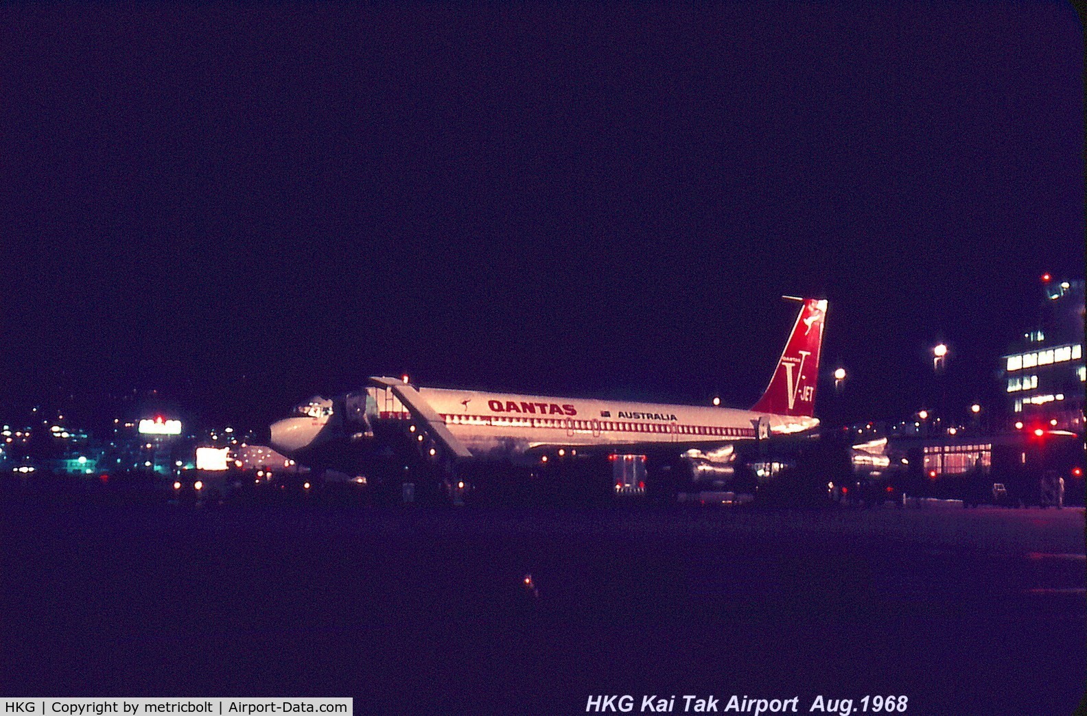 Hong Kong International Airport, Hong Kong Hong Kong (HKG) - Qantas B707 being fueled and catered in HKG Kai Tak in 1968 for late departure