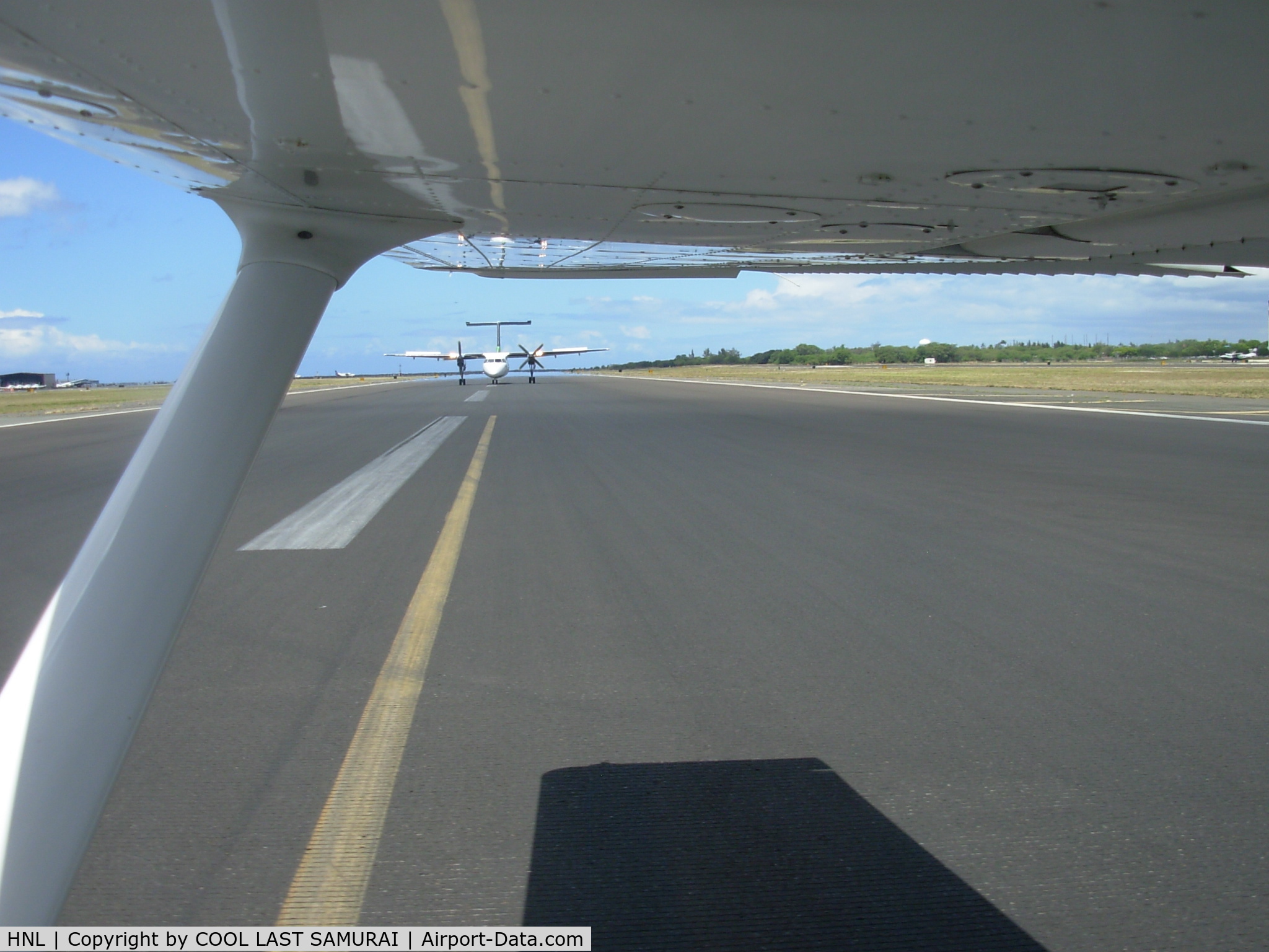 Honolulu International Airport (HNL) - Crossing HNL Rwy04R while a turbo prop holding for us