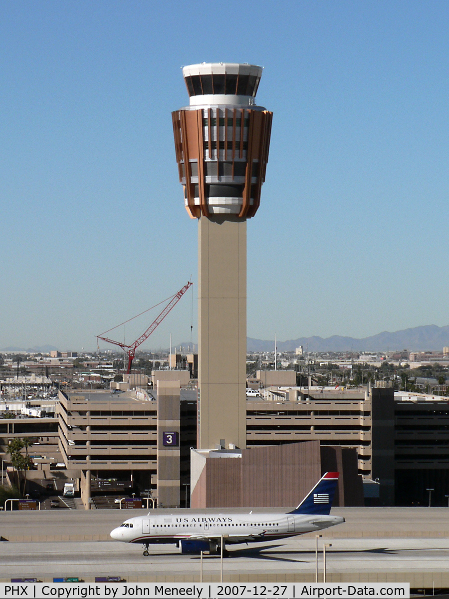 Phoenix Sky Harbor International Airport (PHX) - Good definition of scale between the A319 and the new control tower. The crane in the background is dismantling the old tower.
