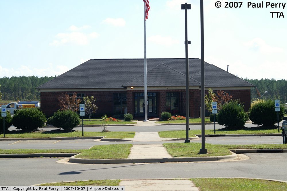 Raleigh Exec Jetport At Sanford-lee County Airport (TTA) - The terminal building, and some idea of the ample parking