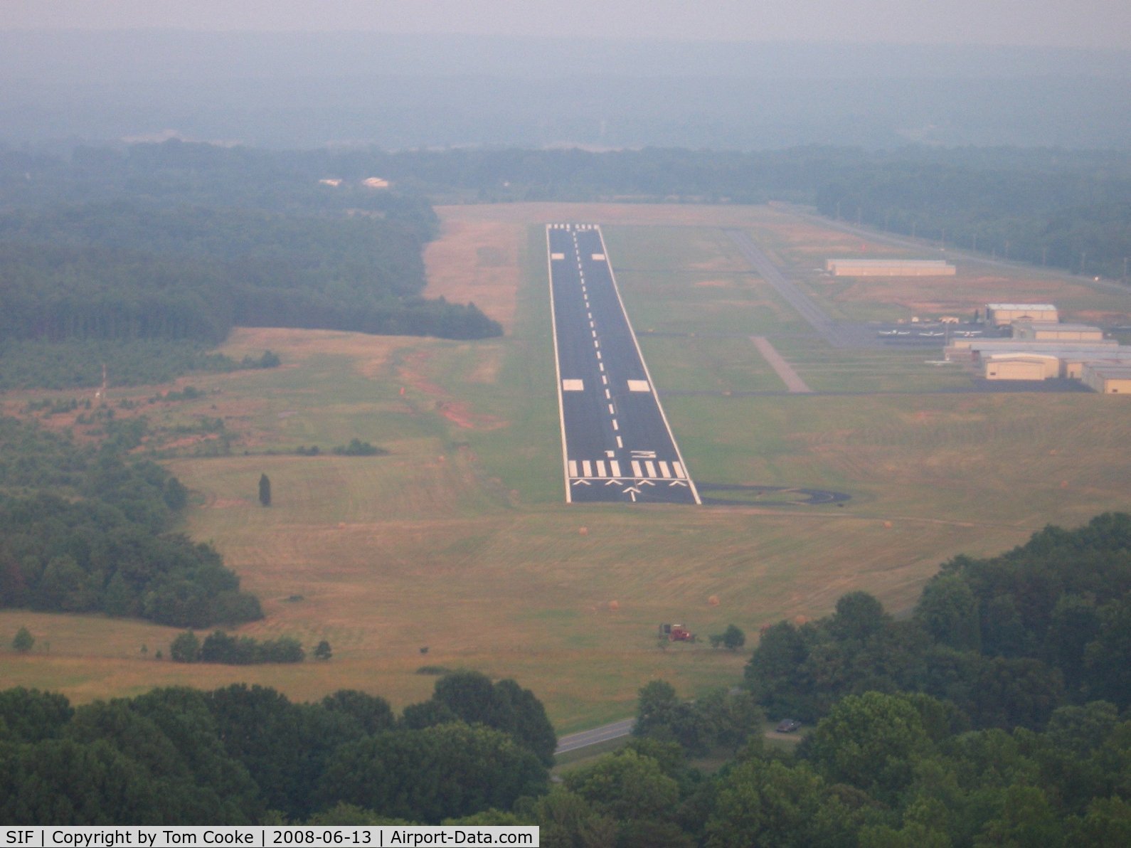 Rockingham County Nc Shiloh Airport (SIF) - short final on a hazy summer evening