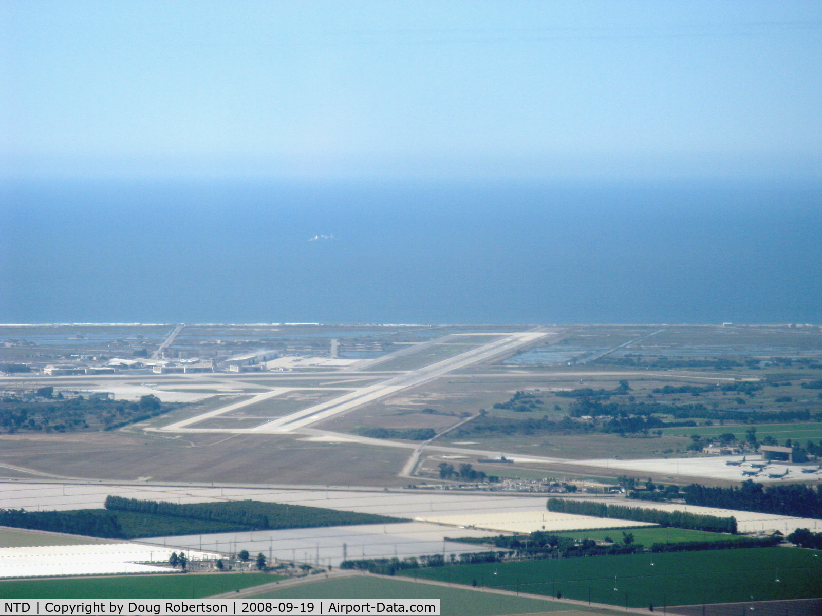 Point Mugu Nas (naval Base Ventura Co) Airport (NTD) - Naval Air Warfare Station, Point Mugu, California. Pacific Ocean beyond. Lower right portion shows Channel Islands Air National Guard taxiway and ramp who shares Point Mugu's two runways. Taken from RV-6, N406L.