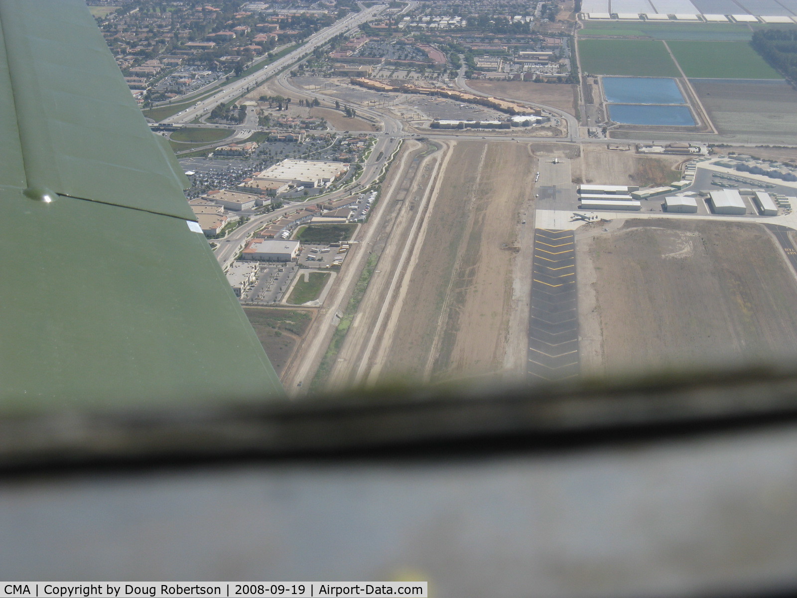 Camarillo Airport (CMA) - Displaced threshold chevron markings to 6,013' Rwy 26. Taken from well overhead runway from Beech 36 BONANZA