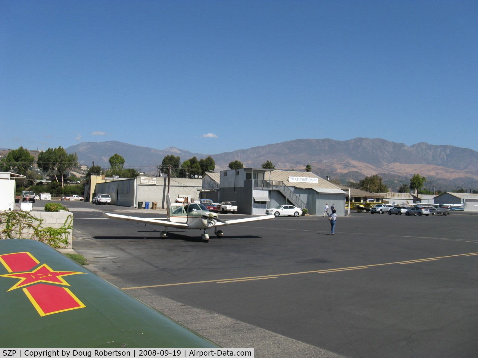Santa Paula Airport (SZP) - Taxi past mid-field self-service fuel dock, CP Aviation FBO beyond.