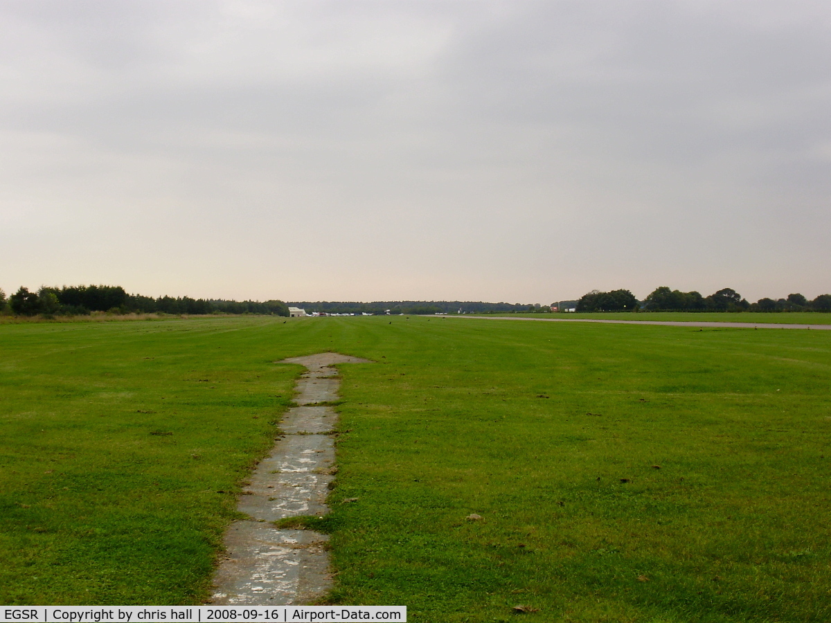 Earls Colne Airfield Airport, Halstead, England United Kingdom (EGSR) - a view down the runway from the passenger seat of the fire truck
