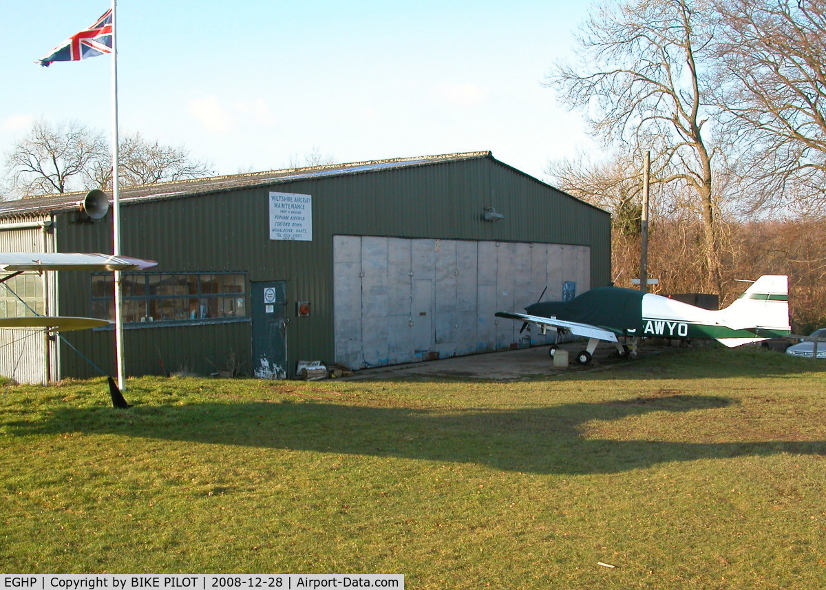 Popham Airfield Airport, Popham, England United Kingdom (EGHP) - WILTSHIRE AIRCRAFT MAINTENANCE HANGER WITH BEAGLE PUP G-AWYO