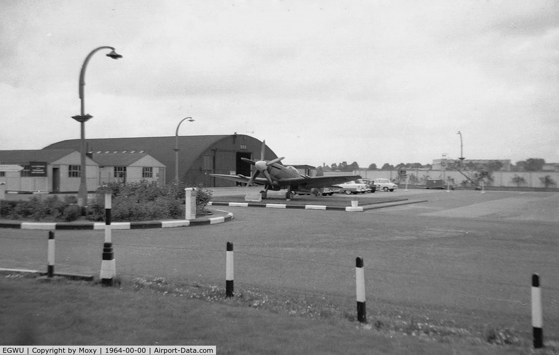 RAF Northolt Airport, Ruislip, England United Kingdom (EGWU) - Old entrance to Northolt on the A40 Western Avenue with Spit F22 PK624 on gate guard duties. Entrance now closed. 