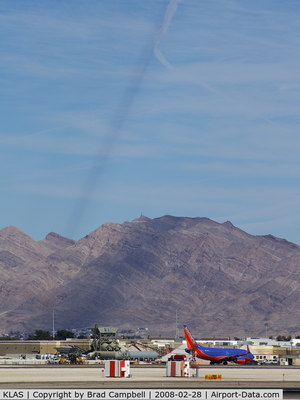 Mc Carran International Airport (LAS) - Contrail shadow being cast on Sunrise Mountain