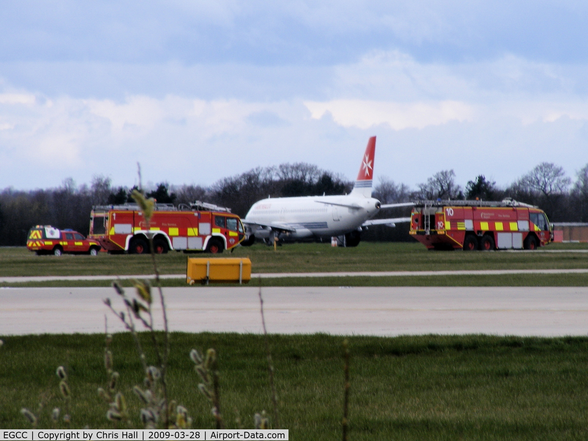 Manchester Airport, Manchester, England United Kingdom (EGCC) - Air Malta A319 9H-AEI made an emergency landing with all the fire trucks in attendance