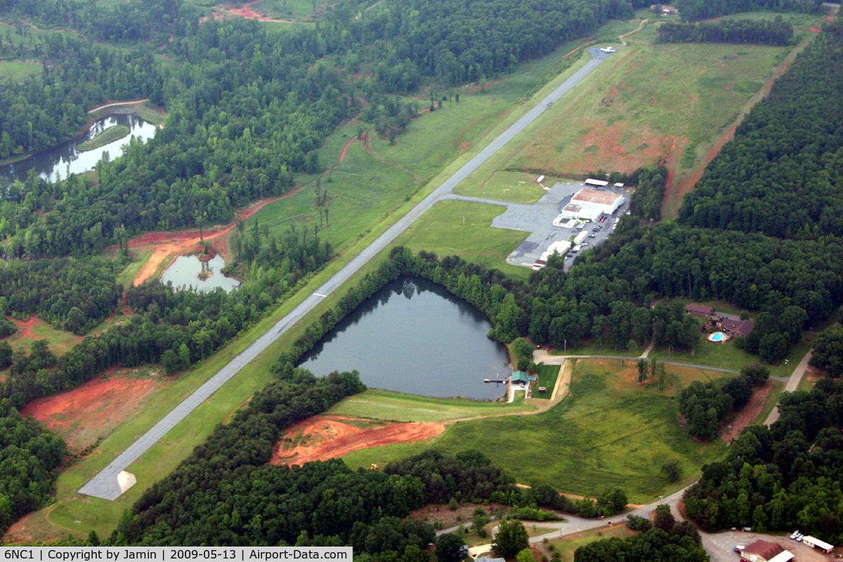 Little Mountain Airport (6NC1) - Little Mountain airport, with a King Air sitting at the end of the runway.