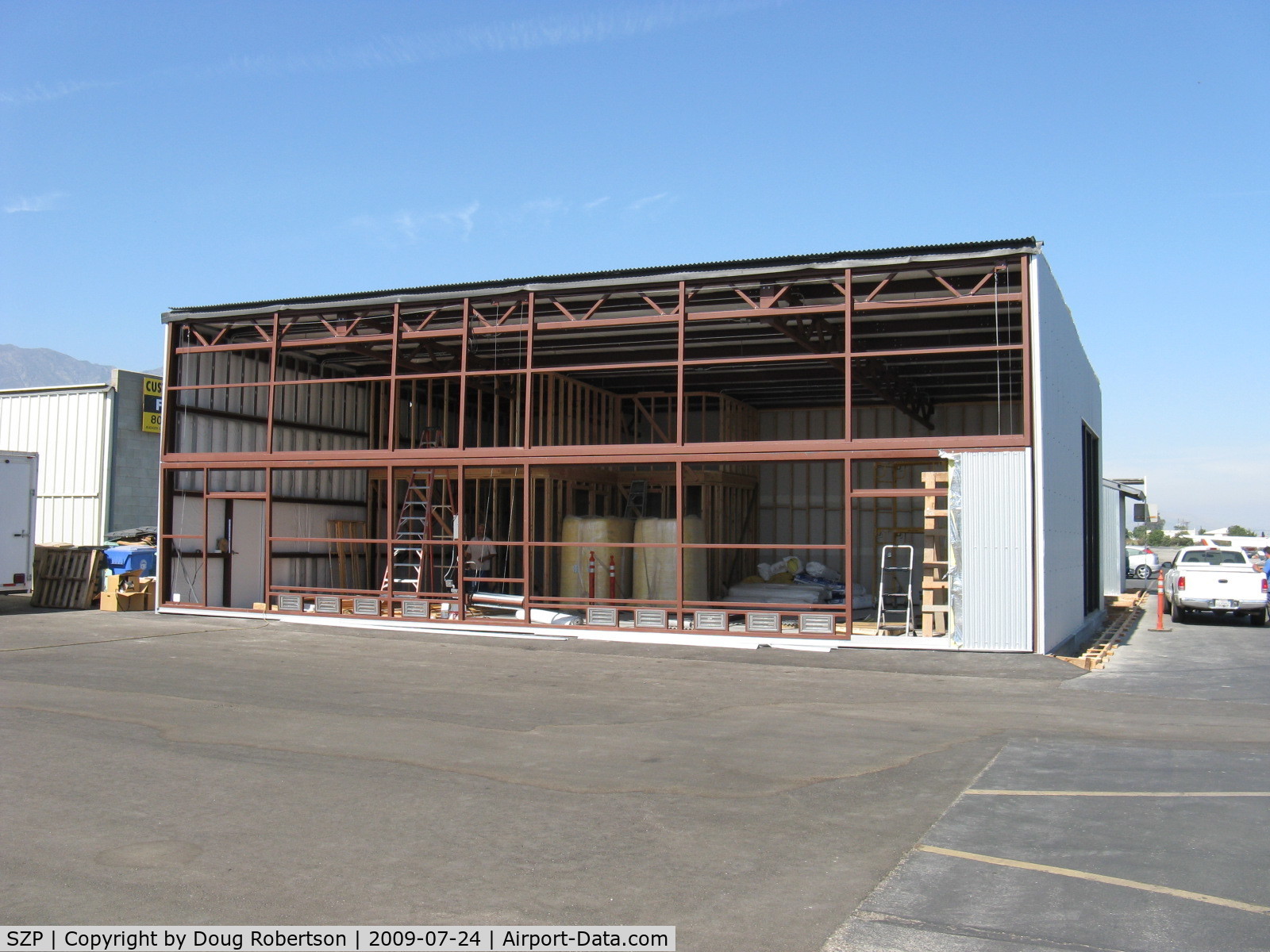 Santa Paula Airport (SZP) - New hangar under construction. Insulated, internal wall studs, framing for two-story rooms in corner