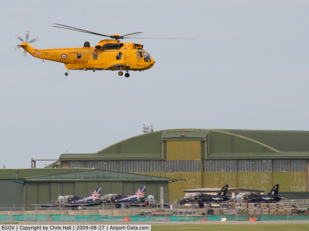 Anglesey Airport (Maes Awyr Môn) or RAF Valley, Anglesey United Kingdom (EGOV) - Sea King HAR.3 XZ591 and seven Hawks