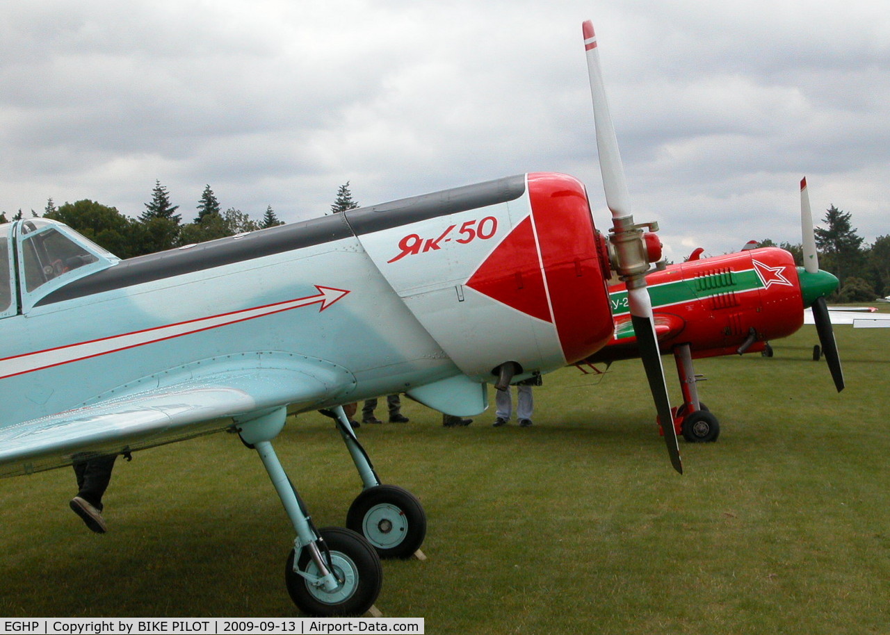 Popham Airfield Airport, Popham, England United Kingdom (EGHP) - YAK-50 G-IIYK AND SU-29 HA-YAO. POPHAM RUSSIAN AIRCRAFT FLY-IN