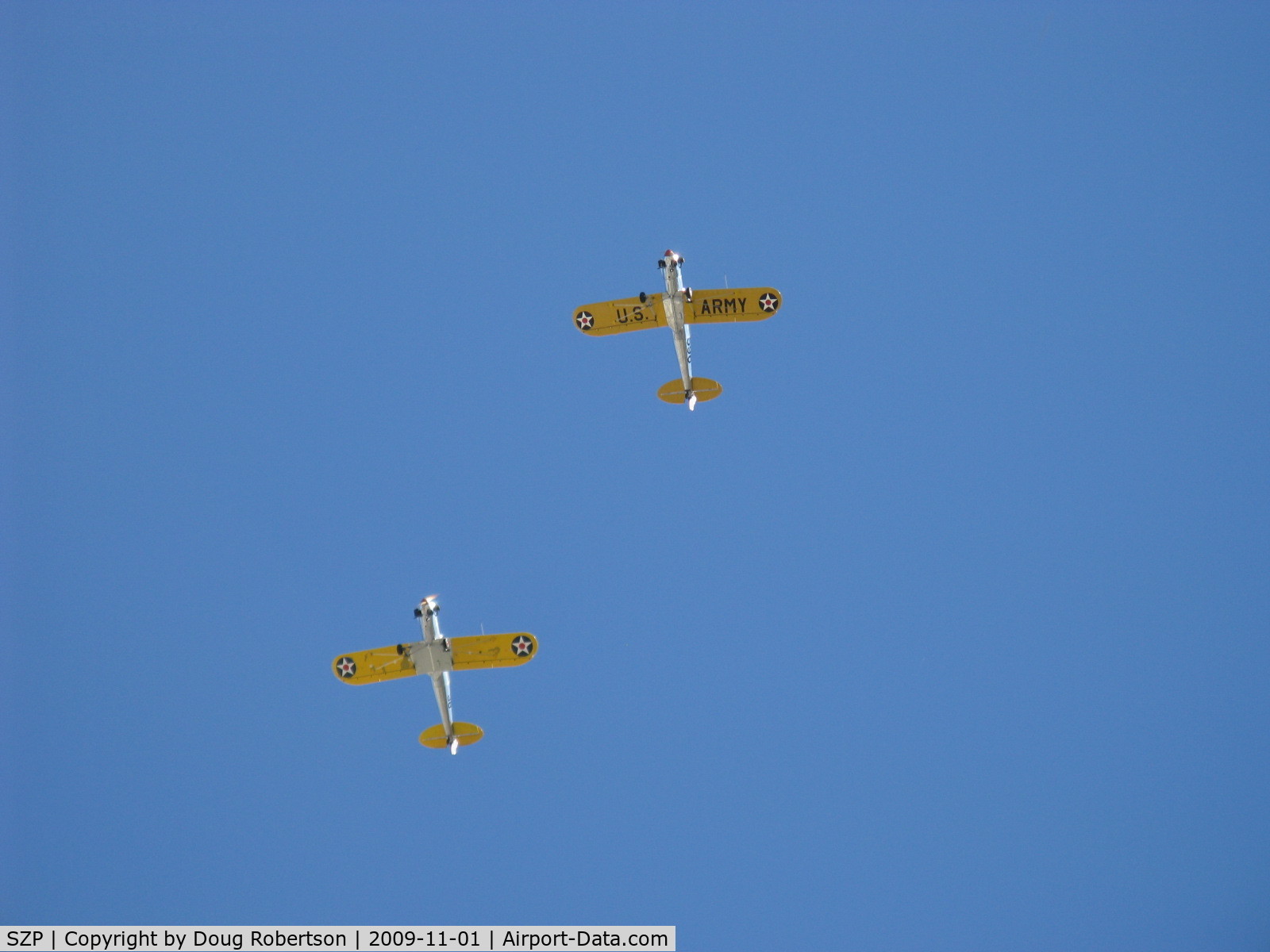 Santa Paula Airport (SZP) - Two Ryan ST-3KRs as PT-22s, N58651 #38 and N53271 #596 (in lead) overhead formation with wonderful 5 cylinder Kinner radial rumbles.