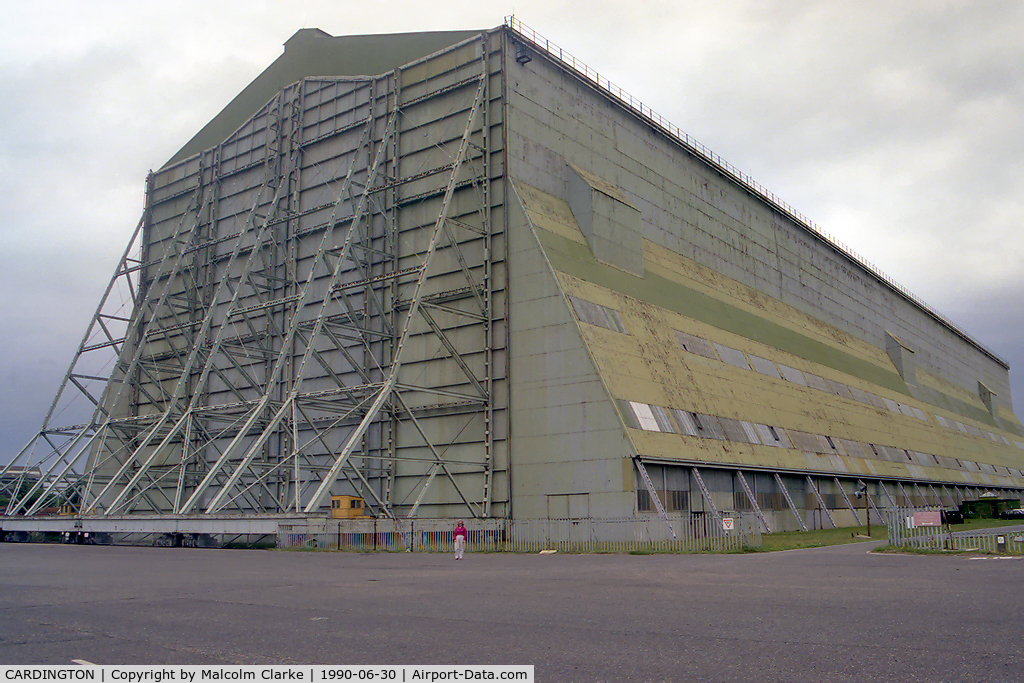 CARDINGTON Airport - One of two airship sheds at former RAF Cardington, built 1916 for the UK’s airship project. Each is 812 ft long, 180 ft wide and 157 ft high and contains 4000 tons of steel. R101 left from here on her ill fated voyage to India. The lovely Ann gives scale.