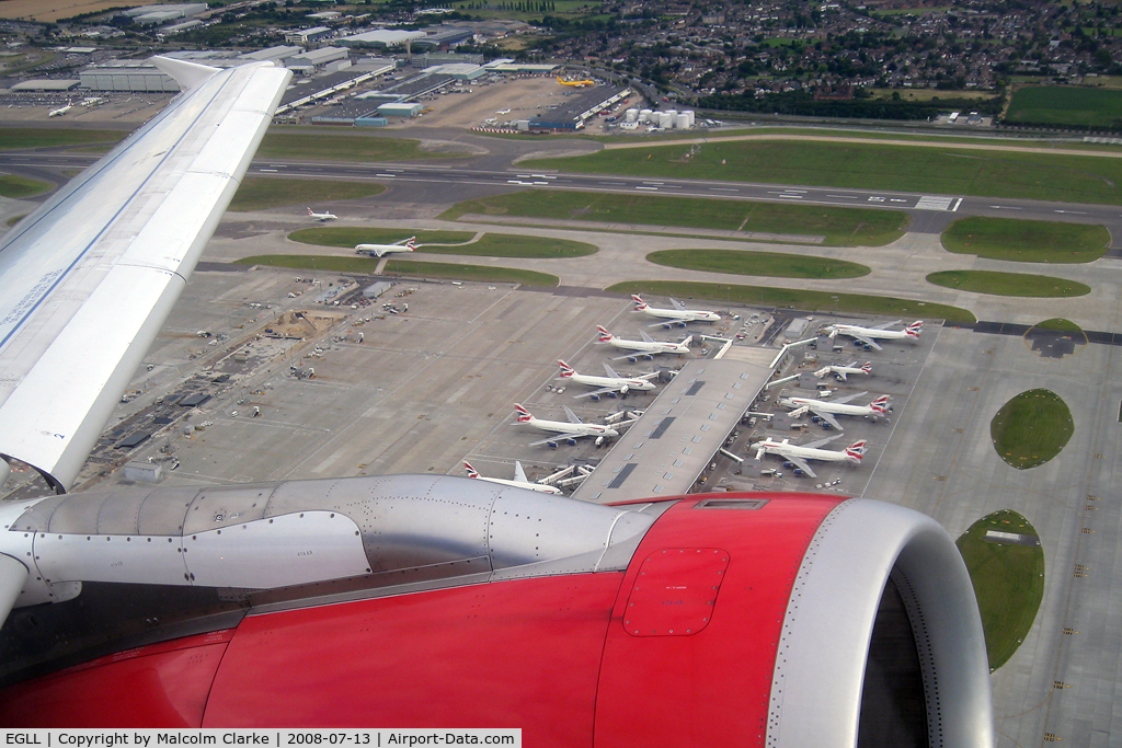 London Heathrow Airport, London, England United Kingdom (EGLL) - Some of British Airway's 747's at Terminal 5 London Heathrow seen from Airbus G-DBCG in 2008.
