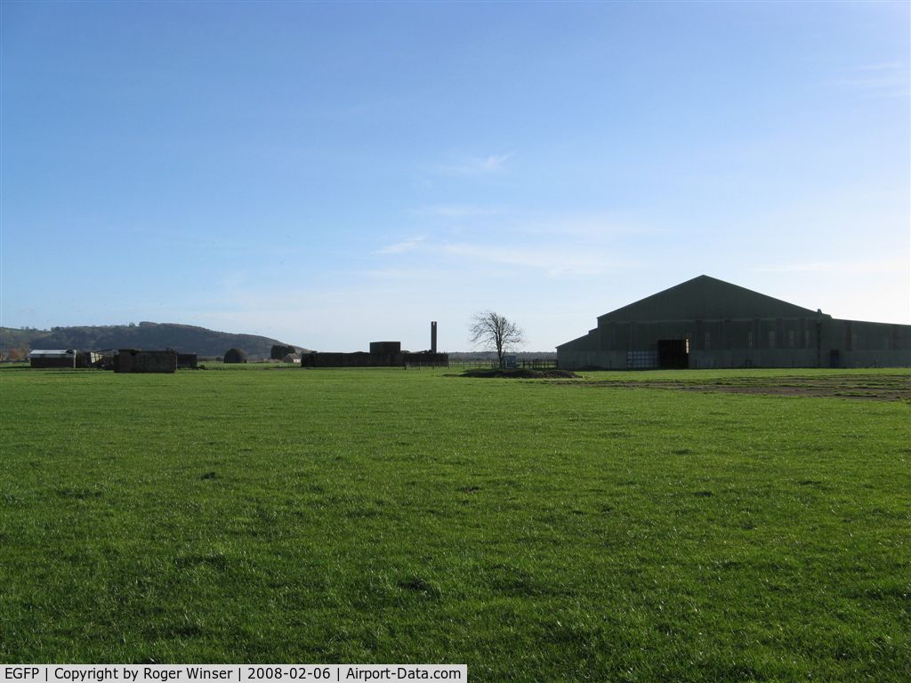 Pembrey Airport, Pembrey, Wales United Kingdom (EGFP) - Former RAF Pembrey airfield technical site. Remaining buildings, one (of two) F type hangar and the land turned over to agricultural use