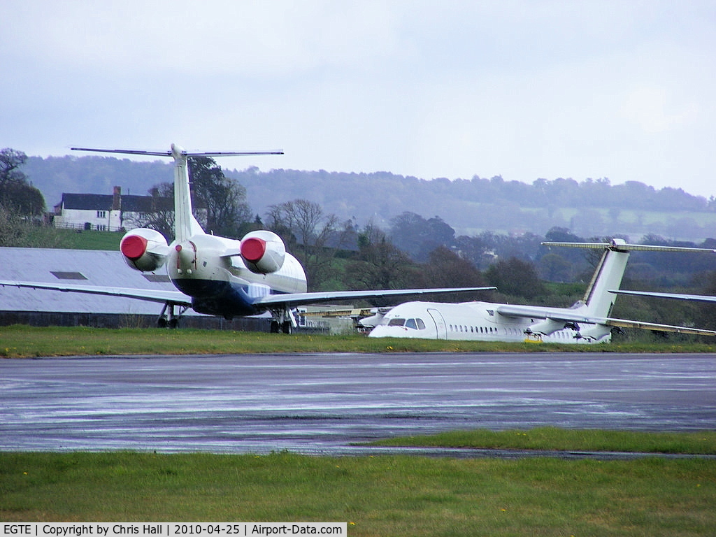 Exeter International Airport, Exeter, England United Kingdom (EGTE) - Embraer ERJ-145 and BAe 146 in storage at Exeter Airport