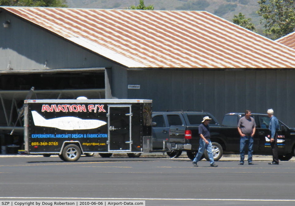 Santa Paula Airport (SZP) - AVIATION F/X trailer in tow between hangars, Experimental aircraft design & fabrication.