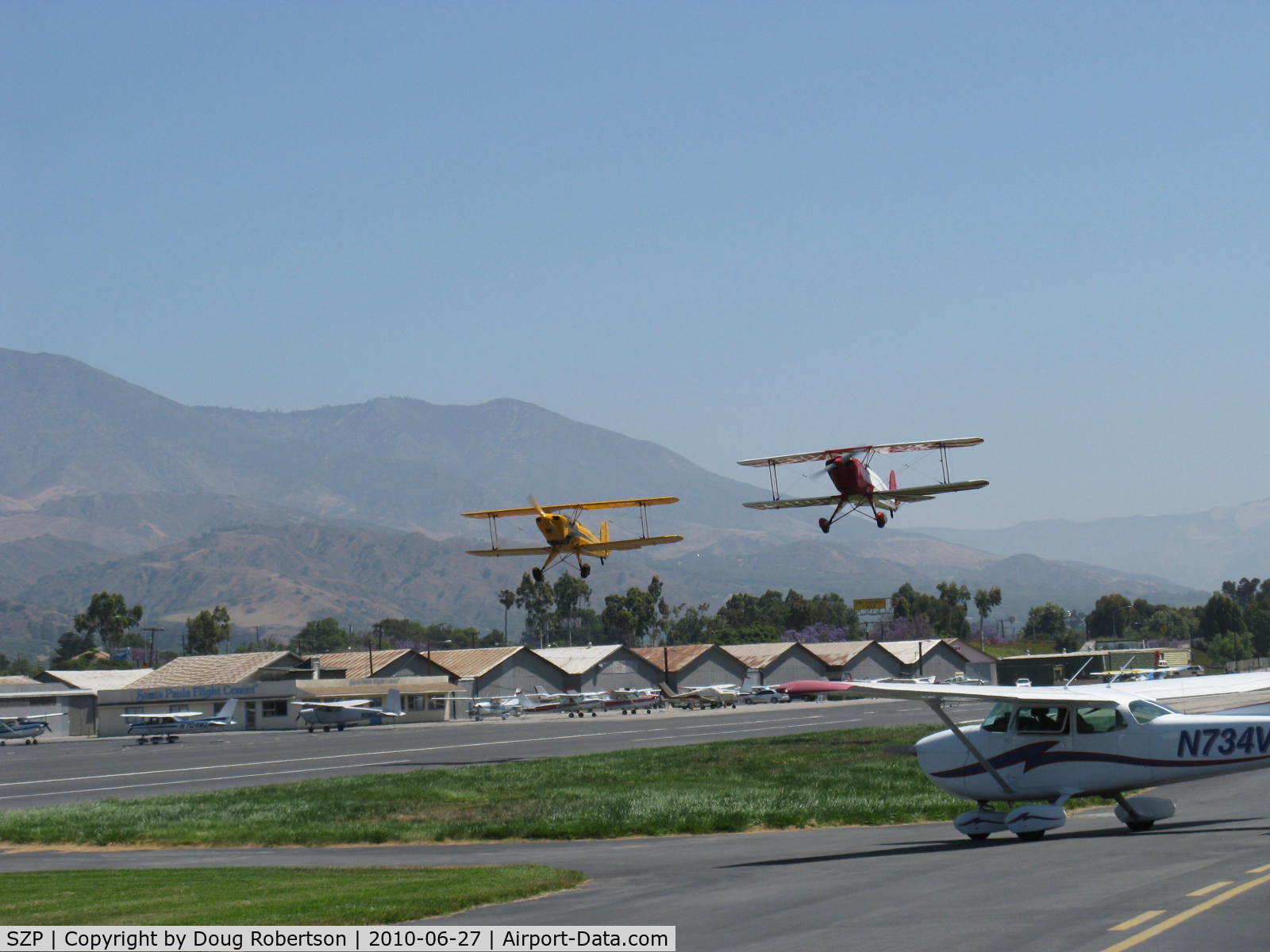 Santa Paula Airport (SZP) - N53EH and N3G in tandem takeoff Rwy 22 at the National Bucker Fly-In