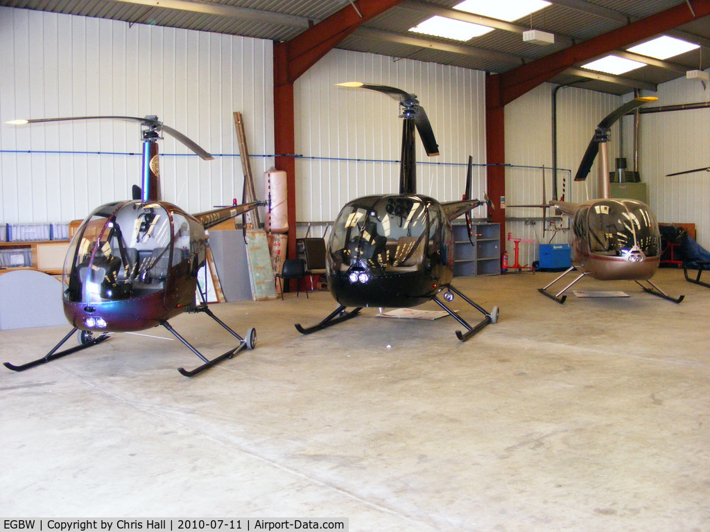 Wellesbourne Mountford Airfield Airport, Wellesbourne, England United Kingdom (EGBW) - Robinson R22 and R44 helicopters in the Heli Air hangar at Wellesbourne Mountford