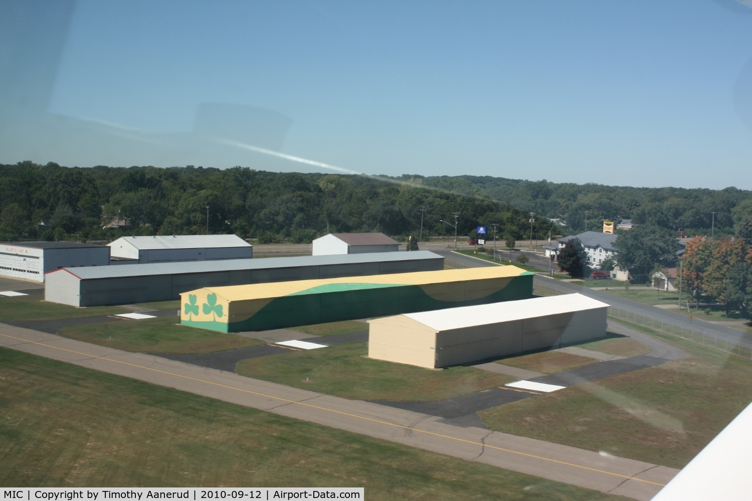 Crystal Airport (MIC) - The FBO Crystal Shamrock wanted to put a sign advertising their business, but either the Metropolitan Airport Commission or the City of Crystal would not allow it.  So, they painted their hangars instead.  Unfortunately they are no longer in business.