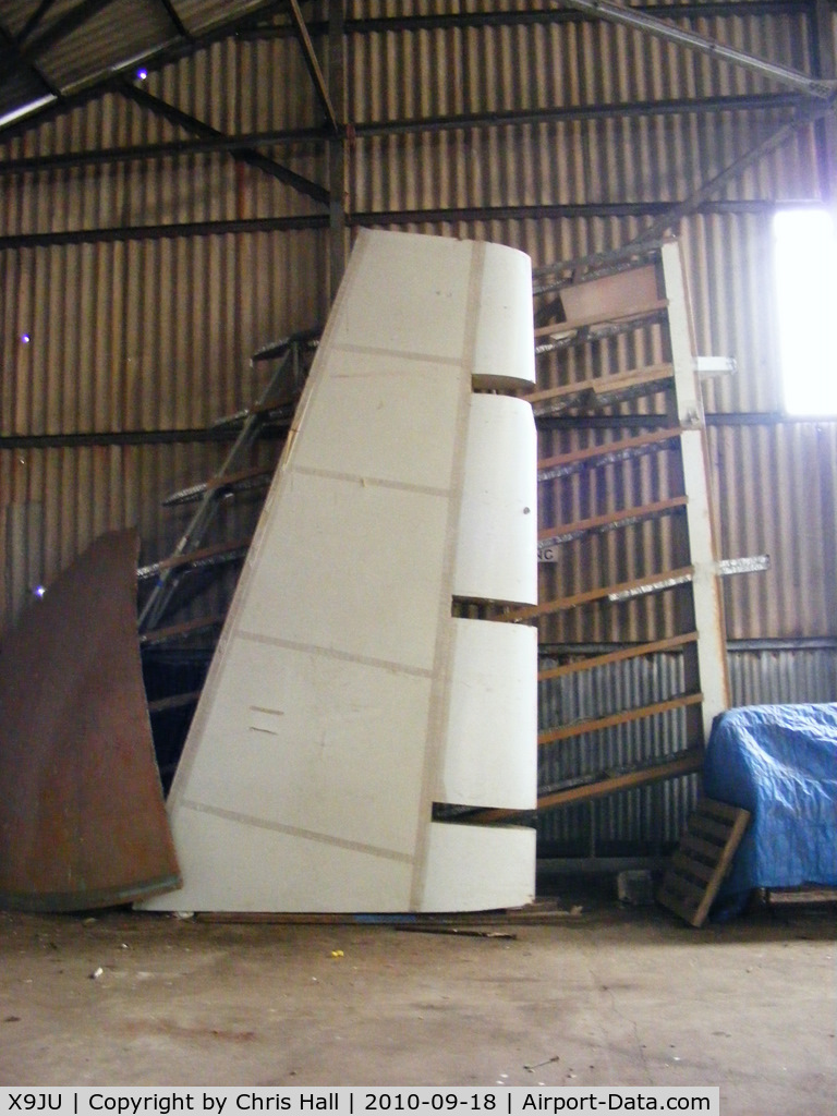 X9JU Airport - Fin of an unknown Airship in storage at Jurby Airfield, IOM.