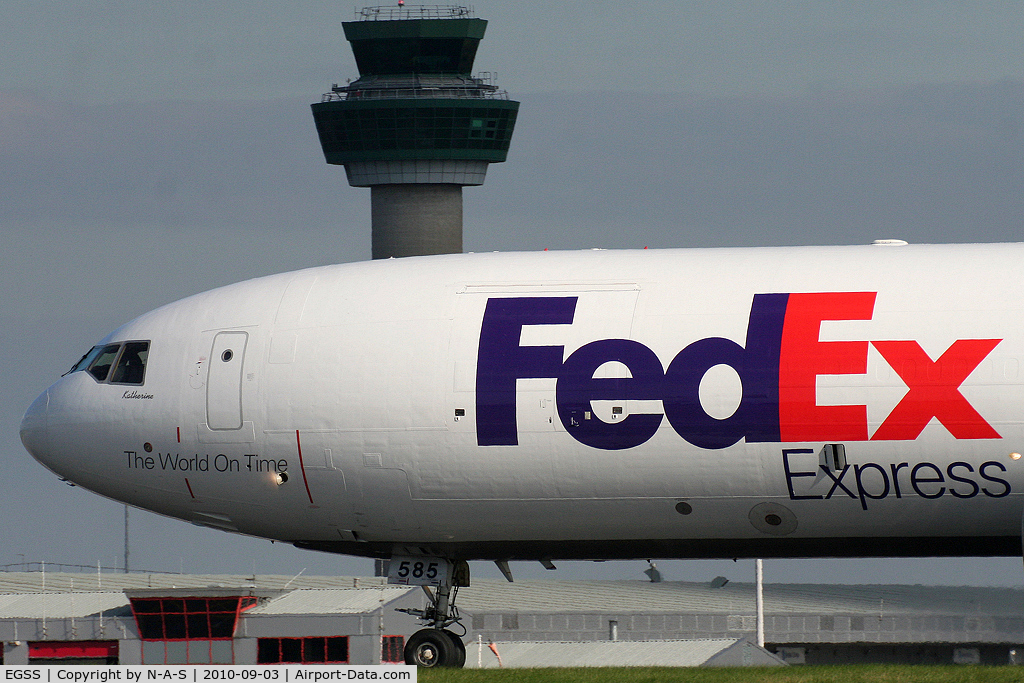 London Stansted Airport, London, England United Kingdom (EGSS) - Fed Ex MD11 passing Stansted's tower
