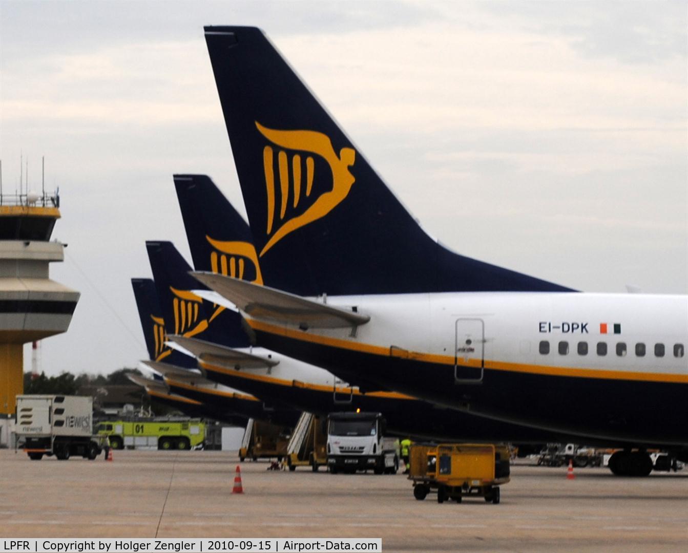 Faro Airport, Faro Portugal (LPFR) - A bunch of right equal RYANAIRliners.
