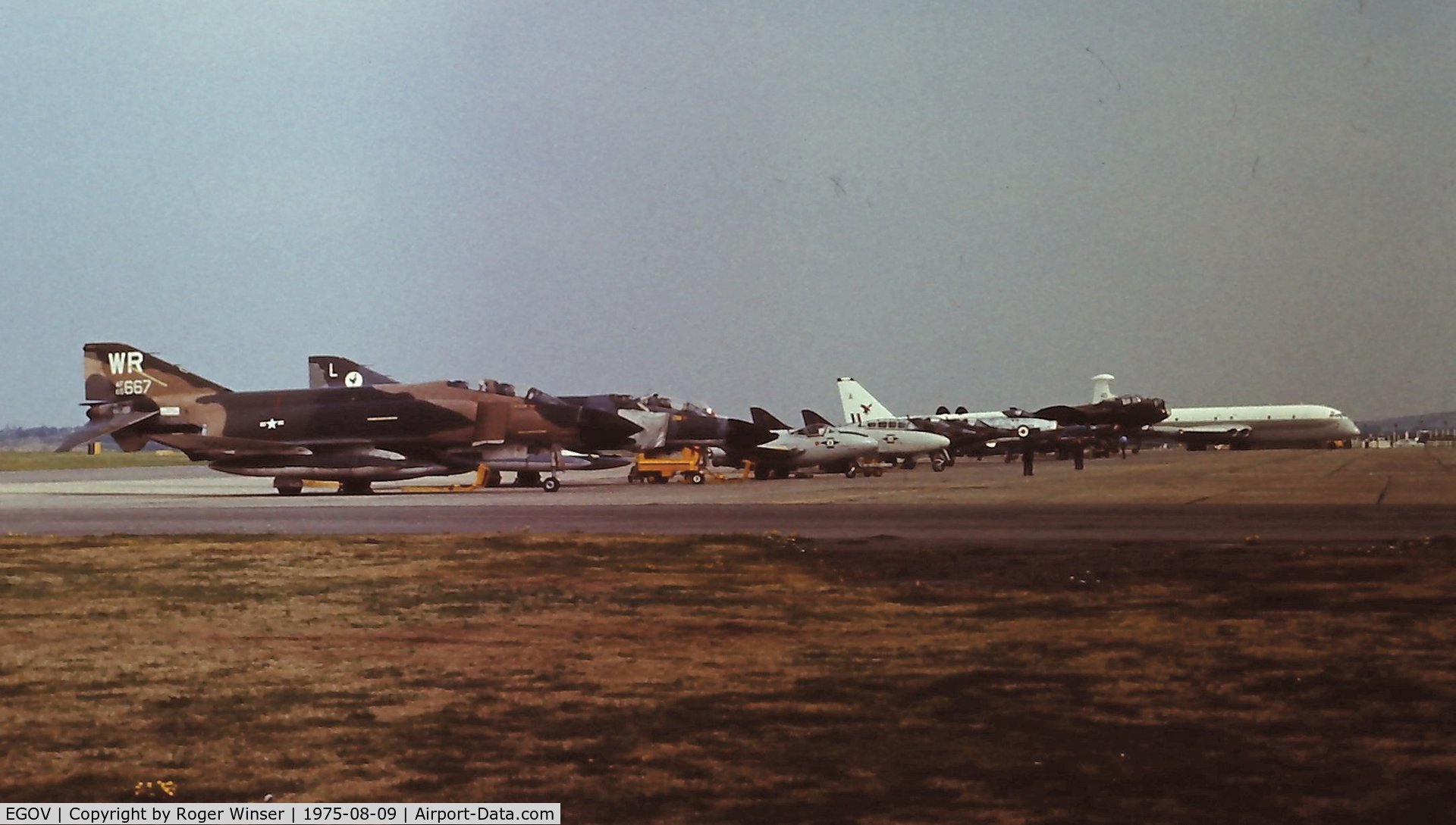 Anglesey Airport (Maes Awyr Môn) or RAF Valley, Anglesey United Kingdom (EGOV) - Line up of visiting aircraft at the RAF Valley Air Show 1975.