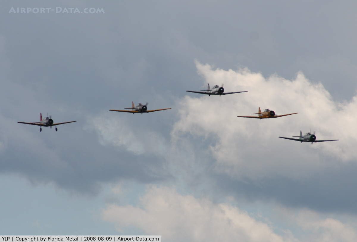 Willow Run Airport (YIP) - T-6s in formation with a single BT-13
