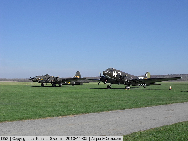 Geneseo Airport (D52) - B-17 The Movie Memphis Belle and C-47 D Day survivor sitting in the grass at Geneseo.