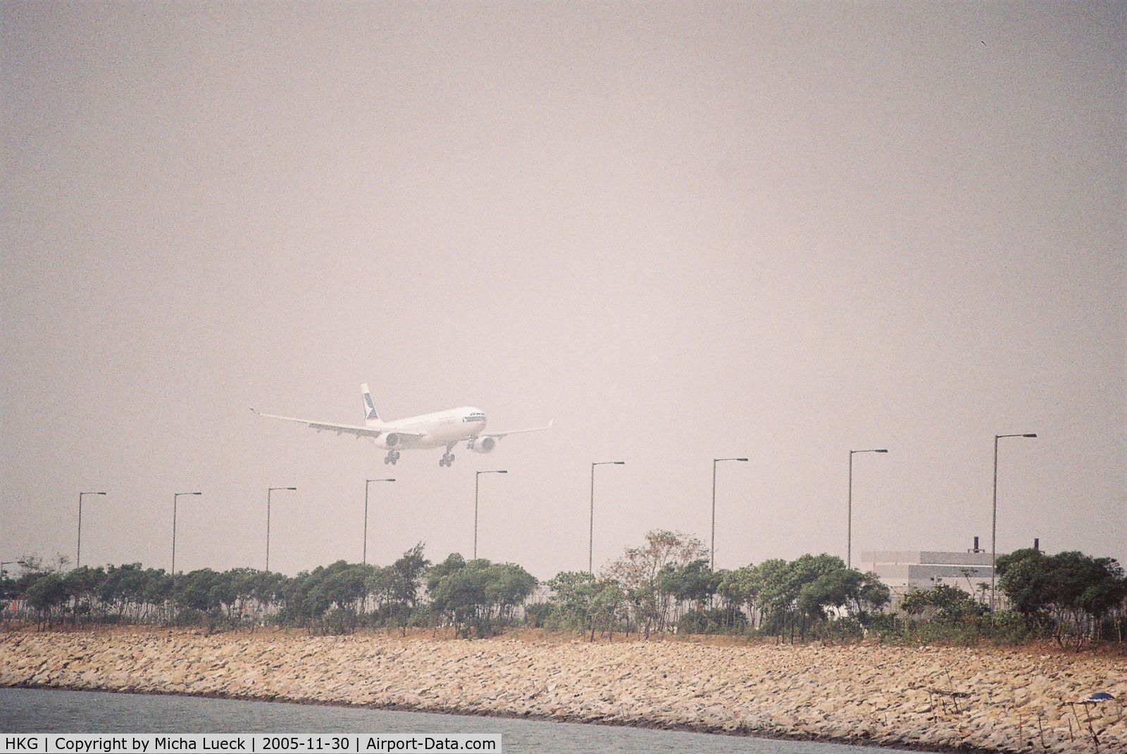 Hong Kong International Airport, Hong Kong Hong Kong (HKG) - The smog adds to a dramatic effect when aircraft appear out of the haze at Hong Kong's Chep Lap Kok airport (A330 of Cathay Pacific Airways)