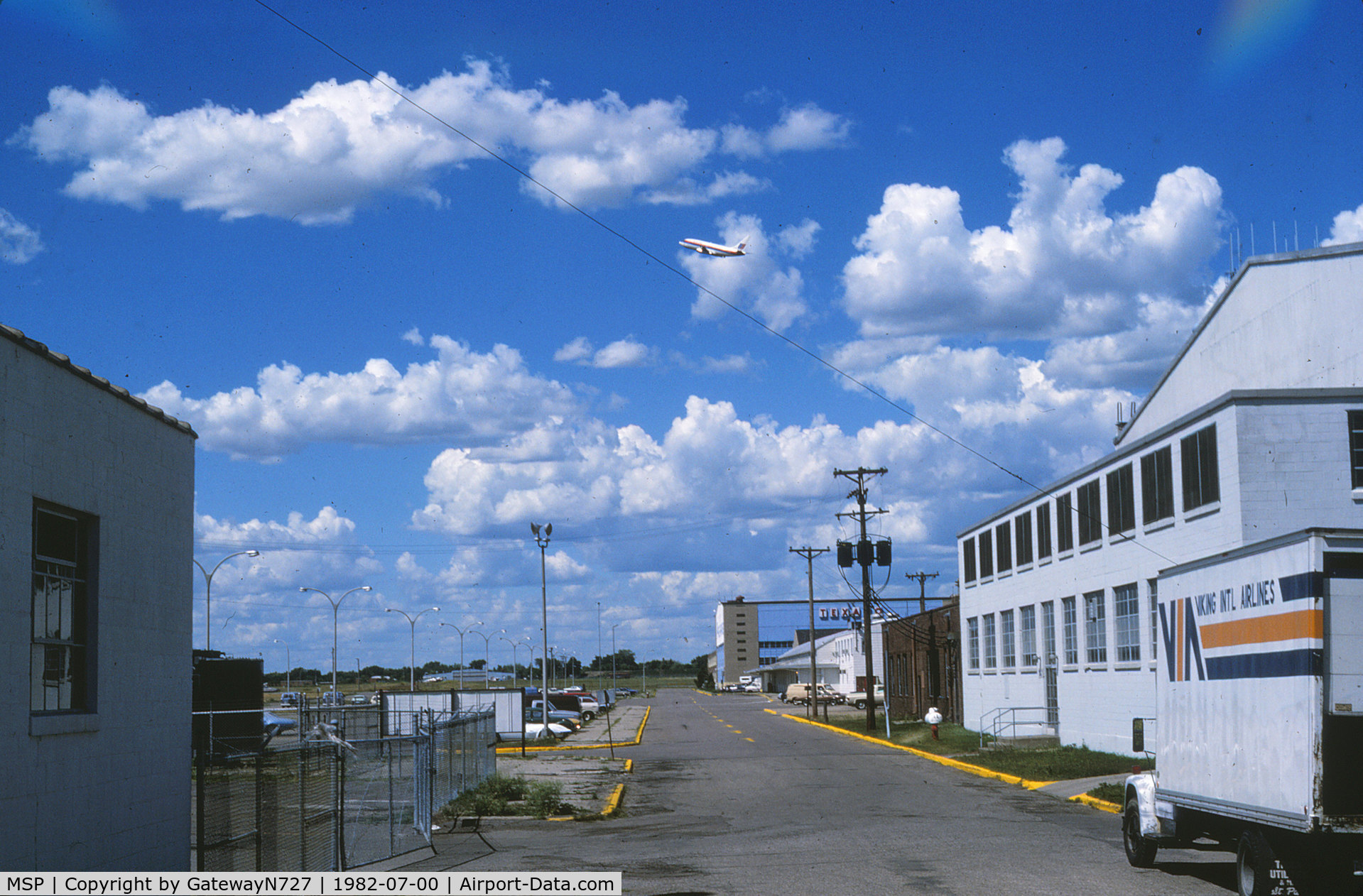Minneapolis-st Paul Intl/wold-chamberlain Airport (MSP) - Looking north along an access road which I believe is now closed to the public. Behind the nearest hangar to the right is the control tower, old airline terminal, MSP FSS, Page (Texaco) hangar and GADO office.