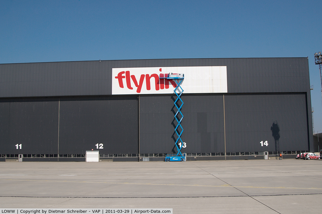 Vienna International Airport, Vienna Austria (LOWW) - Fly Niki titles on the hangar 3 being applied