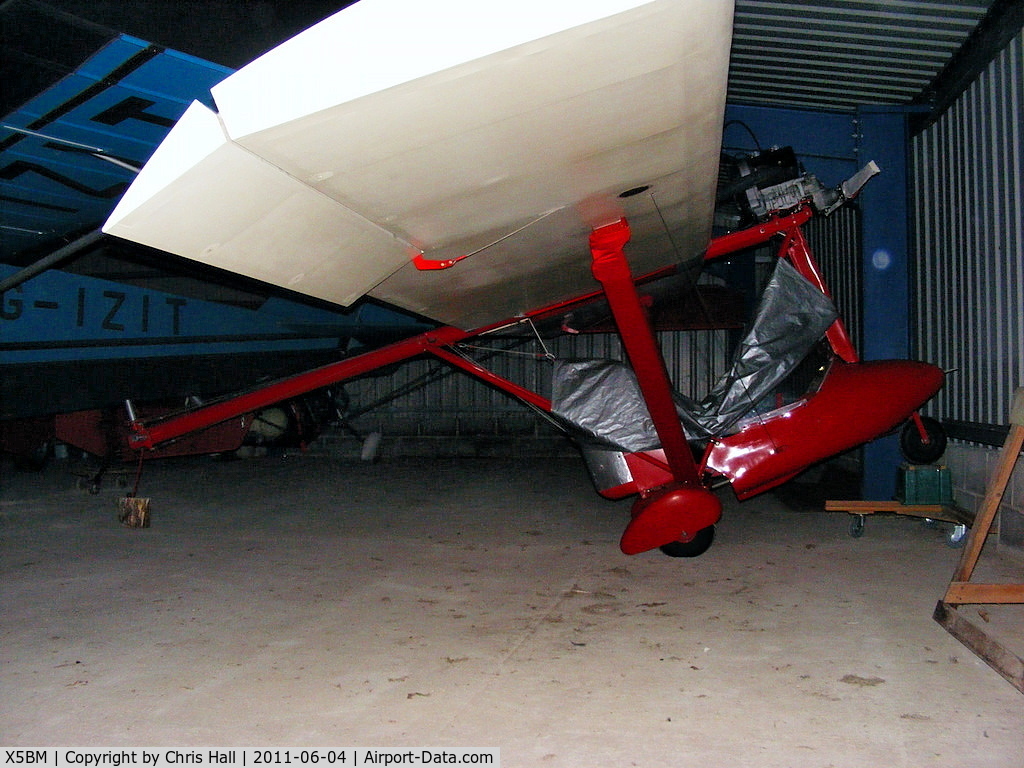 X5BM Airport - unidentified microlight in the hangar at Baxby Manor